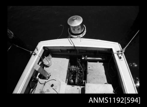 Black and white negative number 17 depicting view of stern cockpit showing steam engine and boiler