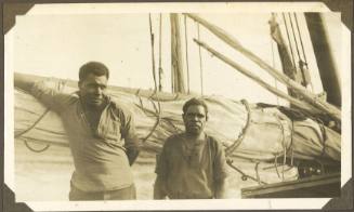 Two men on board a vessel