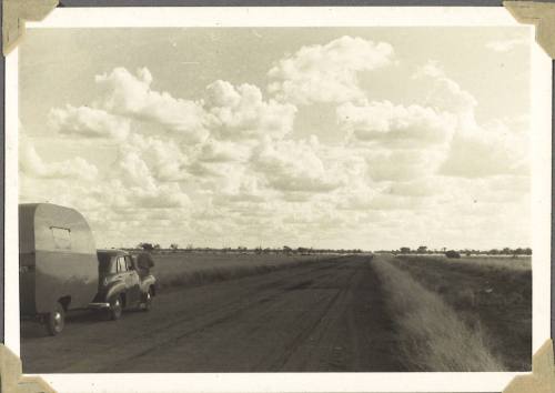 William Clark standing by his caravan