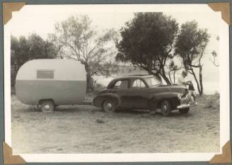 William Clark standing by his car