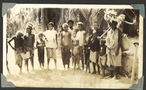 A group of islanders standing on a beach