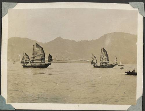 Two Chinese junks in Hong Kong Harbour