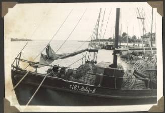 Fishing trawler RUBY-H moored at a wharf with lobster pots