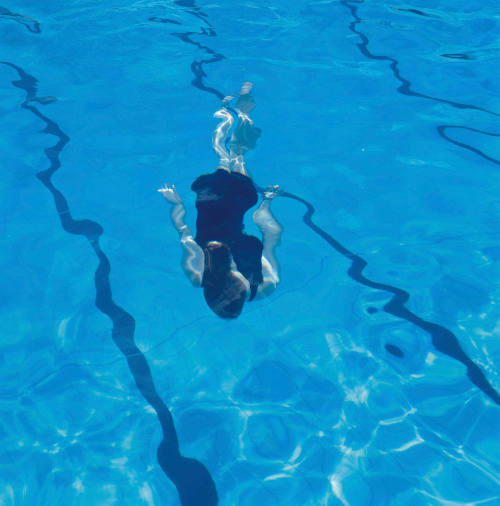 Woman in black underwater, Enfield Swimming Centre