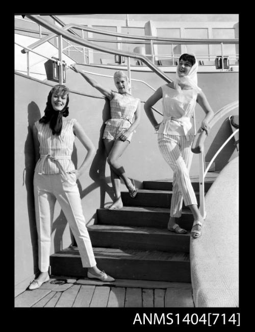 Photographic negative of a three models posing on a ship