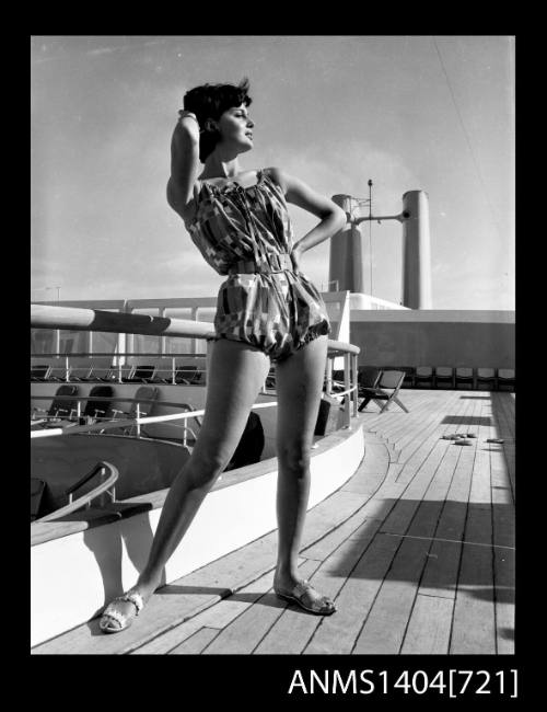 Photographic negative of model posing on a ship