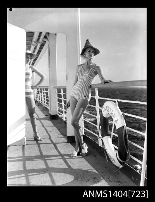 Photographic negative of two models posing on a ship