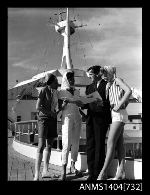 Photographic negative of a four models posing on a ship