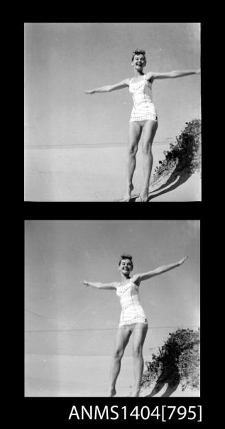 Photographic negative with two frames showing a swimsuit model posing at a beach