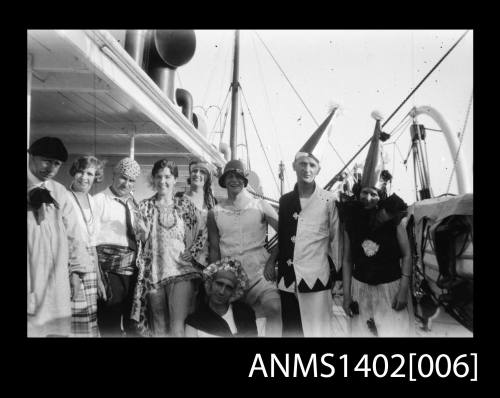 Passengers on deck in fancy dress (E & A Line).  Negative of ANMS1402[005].