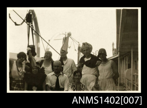 Passengers on deck in fancy dress (E & A Line).