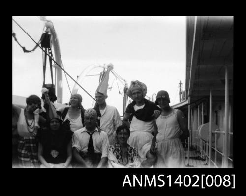 Passengers on deck in fancy dress (E & A Line).  Negative of ANMS1402[007].