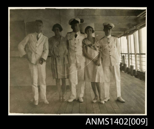 Passengers on deck posing with officers (E & A Line)