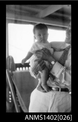 Passenger holding a baby (E & A Line) negative of ANMS1402[025]