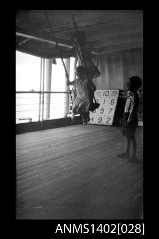 Girl swinging on deck (E & A Line) negative of ANMS1402[027]