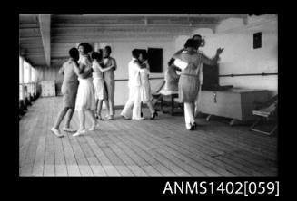 Passengers dancing on deck (E & A Line) [No original print of this negative]
