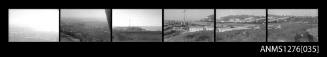 Six black-and-white negatives, joined together, two of which are possibly of a docked boat (the images are very dark)