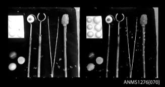 Two black-and-white negatives, joined together, of pearl seeding tools and nuclei, on Pearl Island