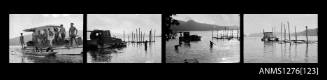 Strip of four black-and-white negatives of a boat in the water, with several people on board and in the water, putting tall wood beams into the water