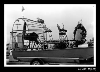 Three seater air boat on road trailer