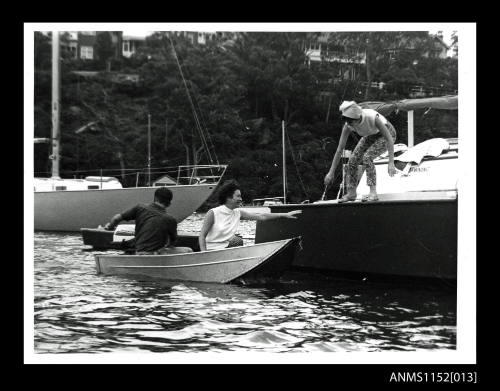 Dinghy and trimaran yacht in Mosman Bay