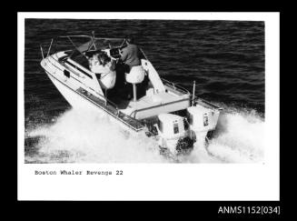 Boston Whaler Revenge 22 Series open power boat at high speed with a man at the controls and woman with child seated next to him
