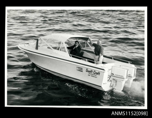 Half cabin power boat with twin Chrysler outboard engines