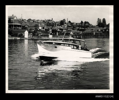 Cabin cruiser sailing on river