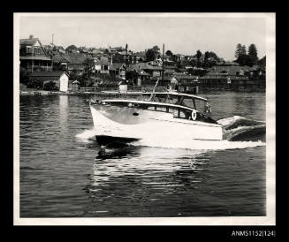 Cabin cruiser sailing on river