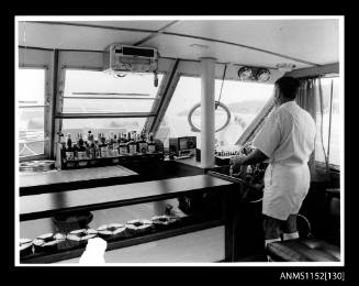 Print depicting interior of cabin cruiser looking forward