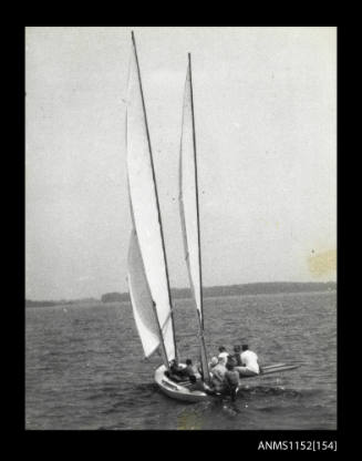 The elevated stern views of twin masted sailing canoe