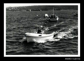 The elevated view of port side of open power boat with windscreen