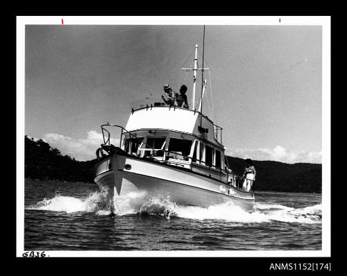 The cabin cruiser unidentified with fly-bridge