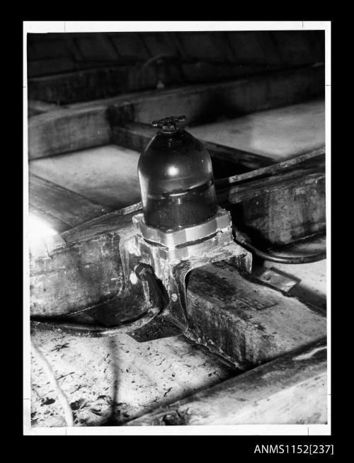 A boats engine fuel filter secured to a main timber in boats hull