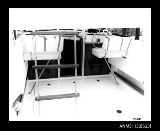 Mariner 28 cabin cruiser showing driver's seat, foot rest and steering wheel