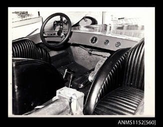 The close up view of drivers cockpit of a Hydroplane not identified showing drivers seat