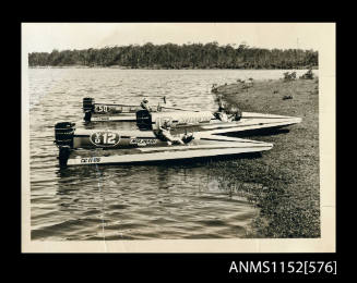 The three identical hydroplane boats grounded