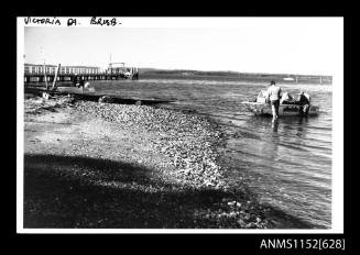 The stretch of water with wooden jetty 