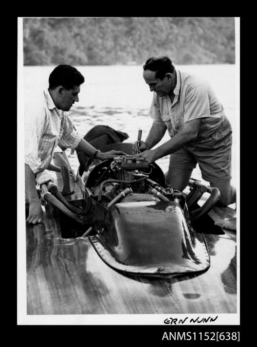 Ern Nunn adjusting carburettors on a hydroplane racing engine