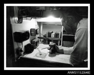 Yachtsman using compass and navigation equipment