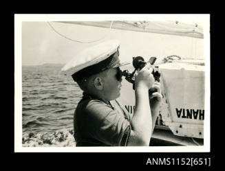 Boy using a sextant