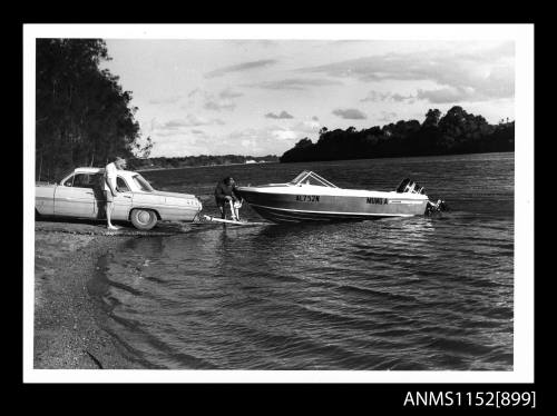 Boat ramp with Al752n Mung open speed boat with Mercury outboard engine