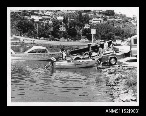 Open power boat PA94N being launched from boat ramp