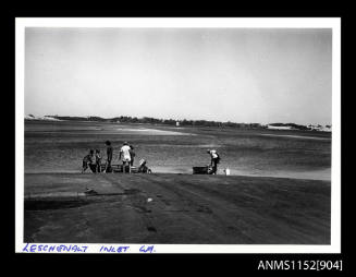 Boat ramp, view taken from roadway in foreground