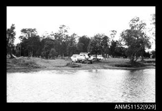 The image of simple graded boat ramp surrounded by trees and picnic area