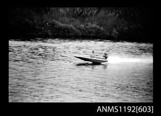 Black and white negative number 4A depicting power boat with outboard engine, at speed