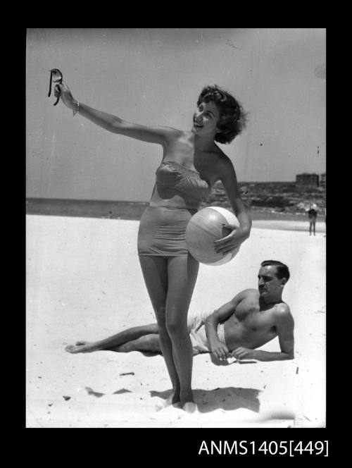 Couple in swimwear on beach