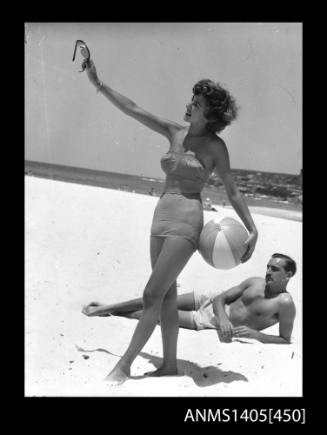 Couple in swimwear on beach