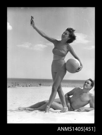 Couple in swimwear on beach