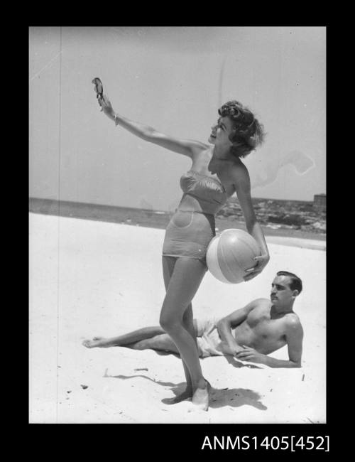 Couple in swimwear on beach